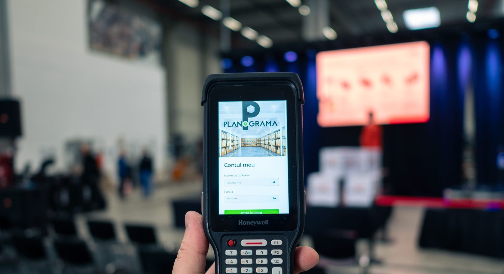 A Honeywell handheld mobile computer running the Planograma app, open at its sign-in screen
